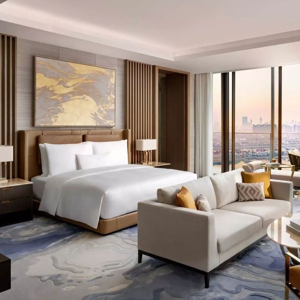 Luxury hotel suite with panoramic city views and elegant contemporary furnishings